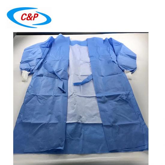 Gorąca sprzedaż Jednorazowe sterylne włókniny niebieskie wzmocnione fartuchy chirurgiczne Dostawcy
