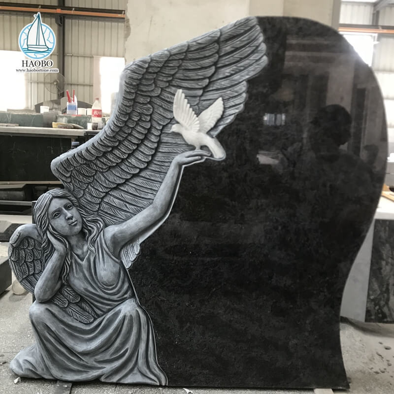 Czarny granitowy anioł z rzeźbionym gołębiem nagrobkiem pogrzebowym
